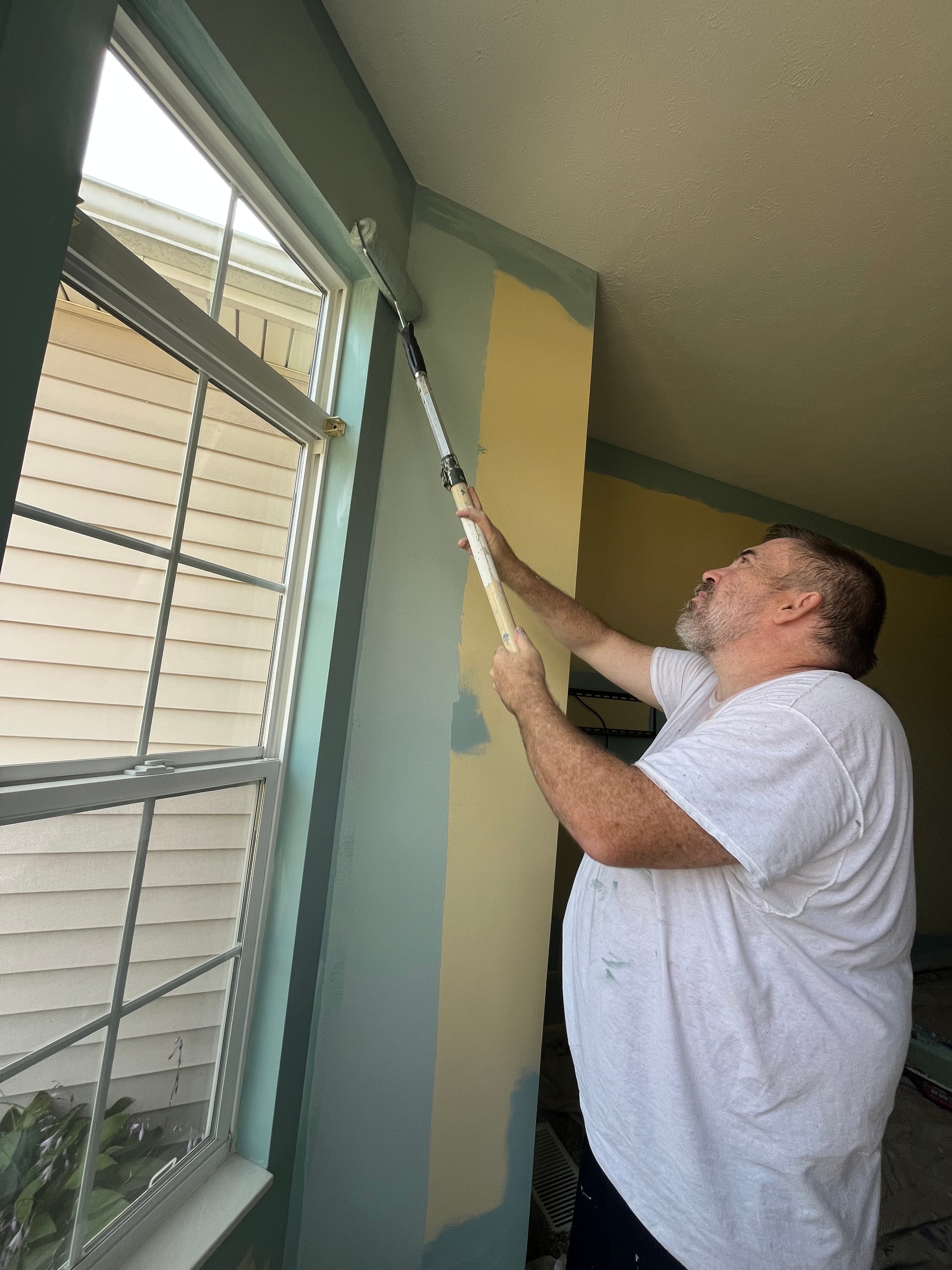Jay painting interior walls of a home in Youngstown Ohio